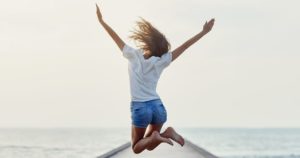 back-view-of-jumping-girl-on-the-pier-300x158